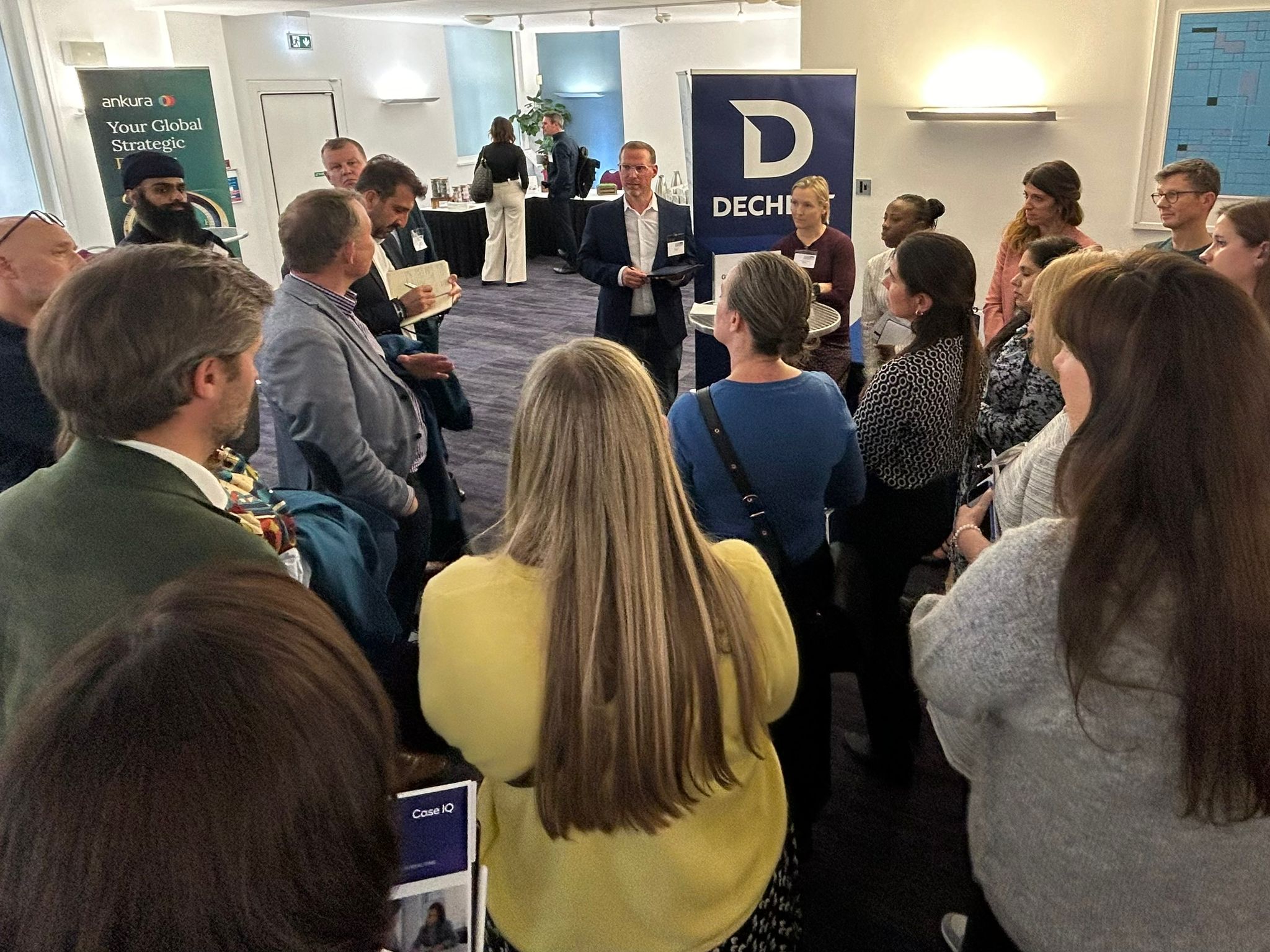 Delegates in discussion at a Global Insight Conferences event